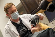 Dr Foust performing implant surgery.